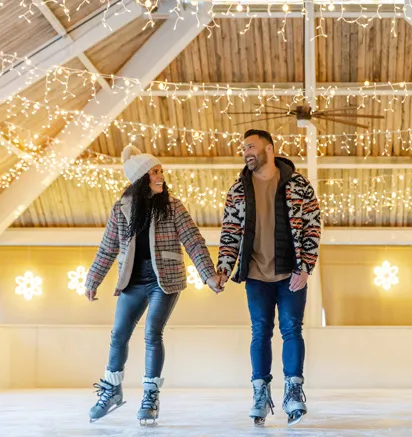 Two guests ice skating at Tenaya at Yosemite
