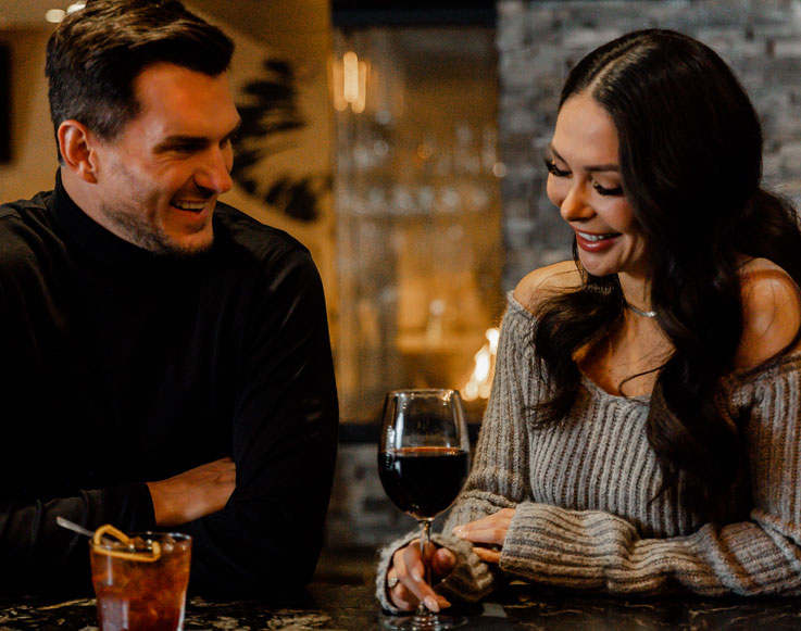 Couple enjoying a drink at the bar