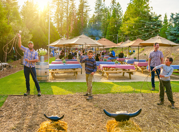 Tenaya Lodge guests learning how to swing a lasso