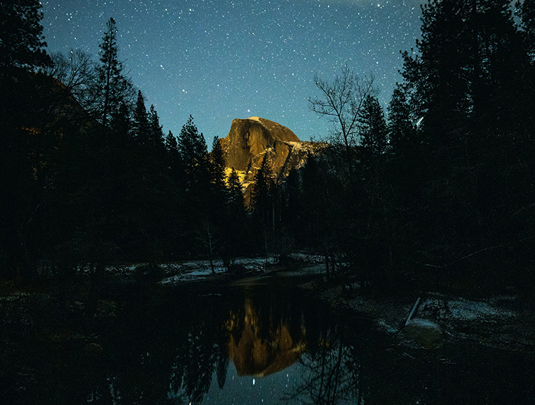 Winter in the Sierras 4 A beautiful photo of Half Dome under a starry night sky