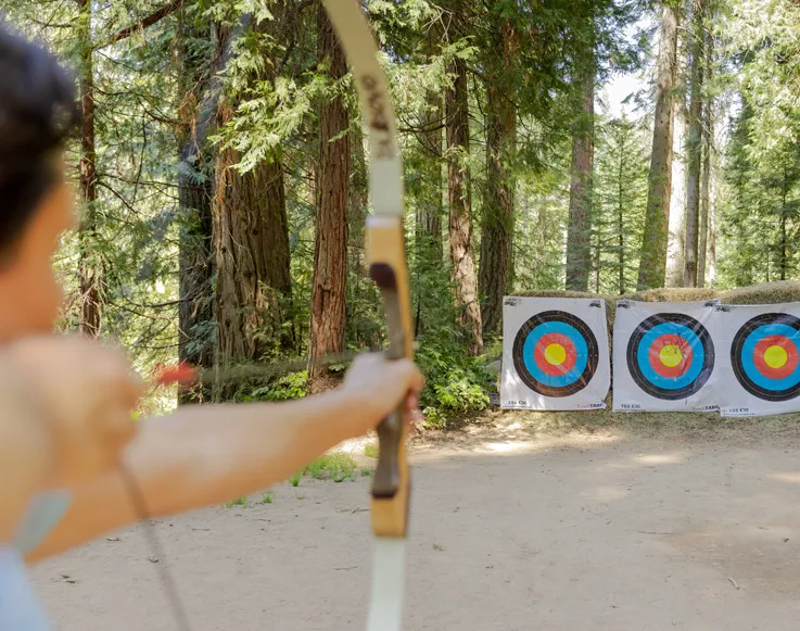 A guest practicing archery at Tenaya at Yosemite