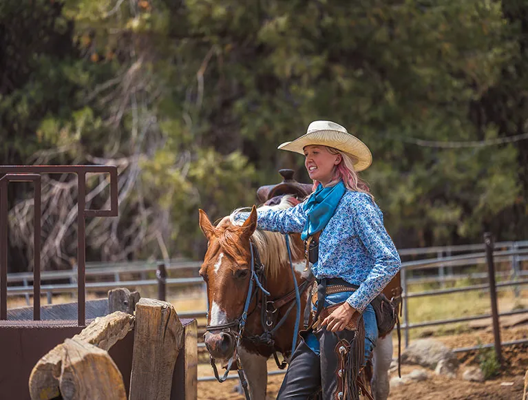 Discover Hidden Gems Beyond Yosemite 5 A woman walking a horse for an adventure with Yosemite Trails