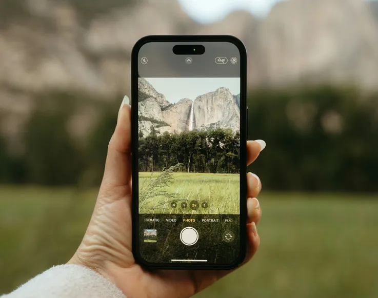 Experience 2 A guest taking a photo of Yosemite Valley