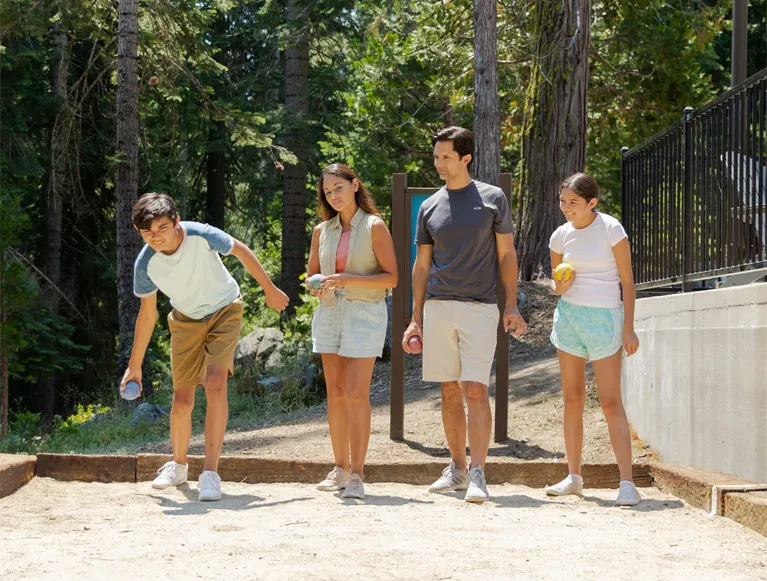 Included In Your Stay 3 A family playing bocce ball at Tenaya at Yosemite