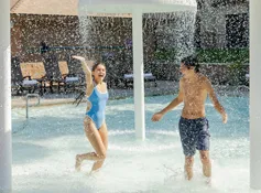 Two kids playing in the outdoor pool area at Tenaya at Yosemite