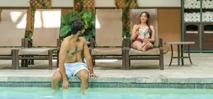 Two guests enjoying the indoor pool at Tenaya at Yosemite