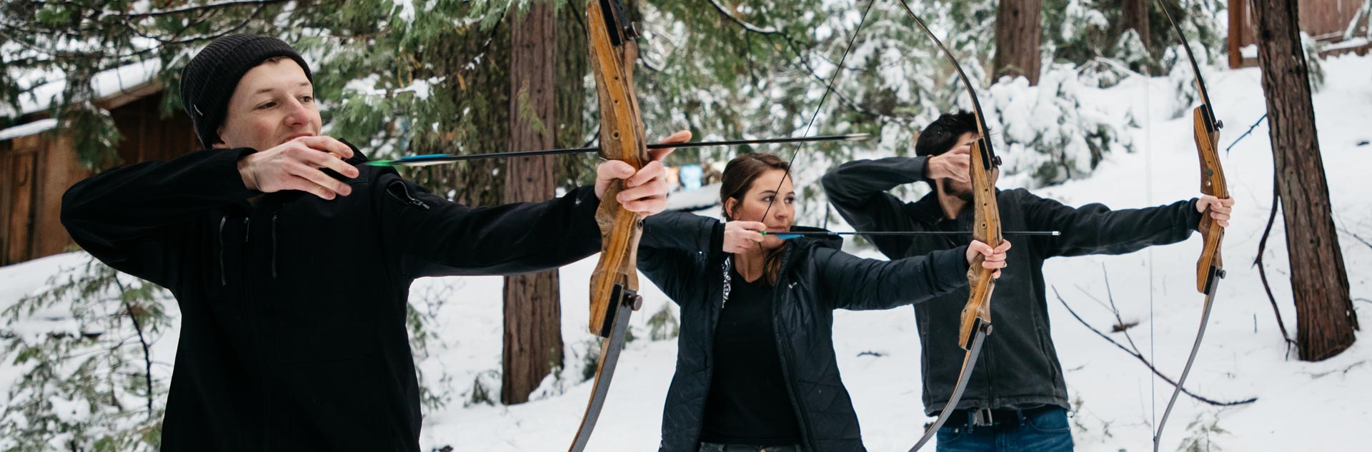 Tenaya at Yosemite guests practicing archery in winter