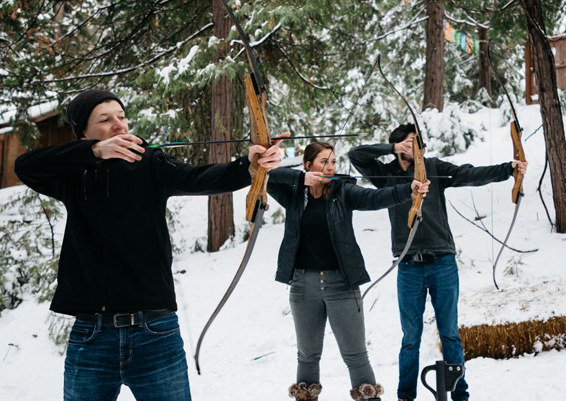 A group of Tenaya visitors learning archery in winter