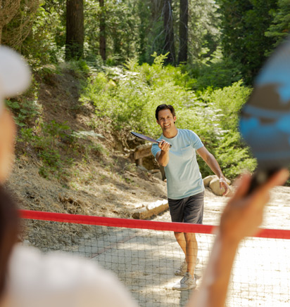 Two guests playing pickleball at Tenaya at Yosemite