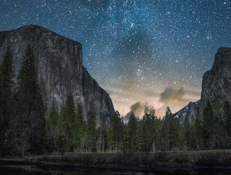 Yosemite Valley at night under a starry sky