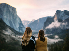 Two visitors taking in a view of Yosemite Valley