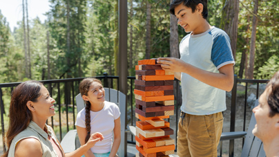 A family playing Jenga at Tenaya at Yosemite