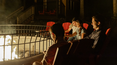 A family roasting marshmallows at Tenaya at Yosemite