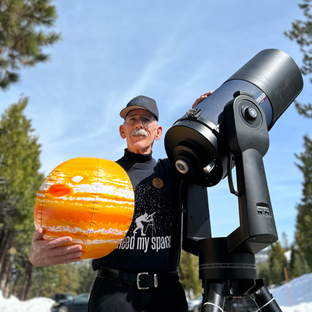 Astronomer Andy Skinner with his telescope