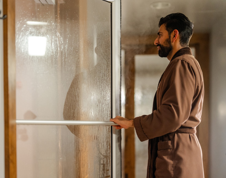 A guest using the sauna at the Ascent Spa at Tenaya at Yosemite