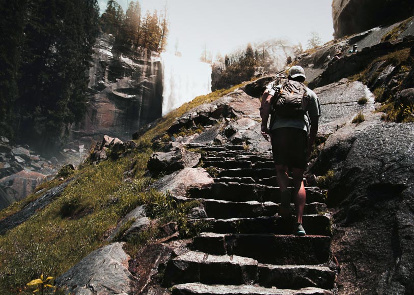 A Yosemite National Park visitor hiking the Mist Trail to Vernal Falls