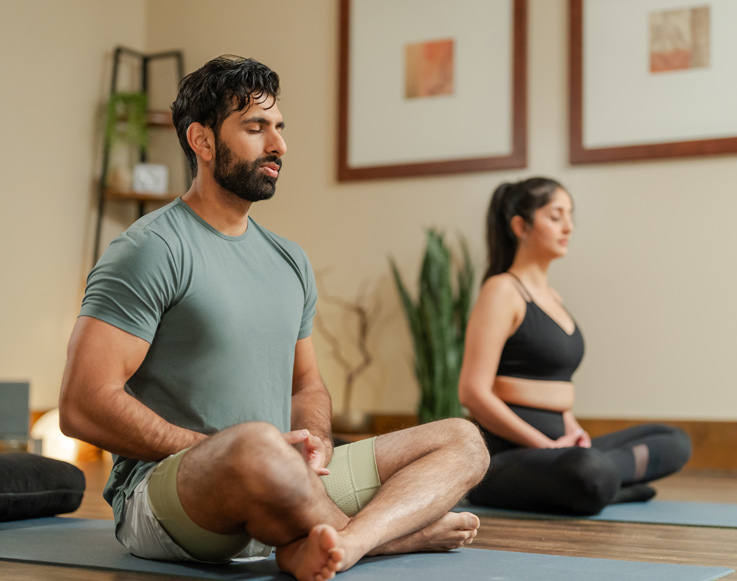 A couple doing yoga at Tenaya at Yosemite