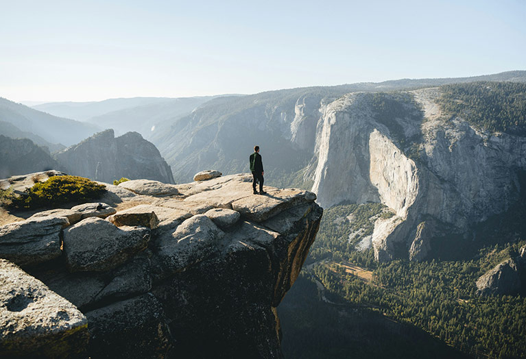 A hiker at Taft Point in Yosemite National Park