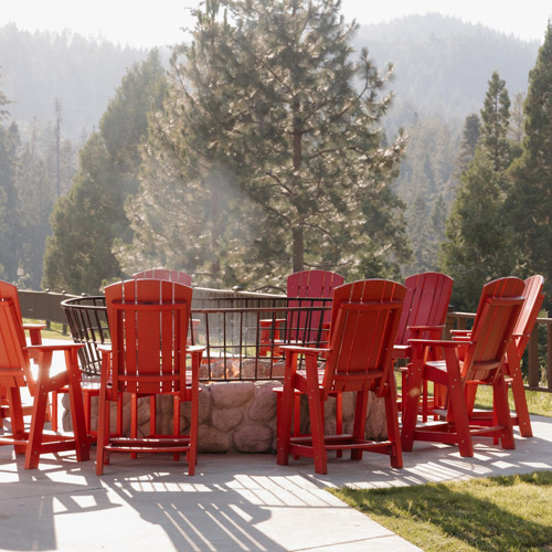 Weddings 8 Adirondack chairs around an outdoor fire pit at Tenaya at Yosemite