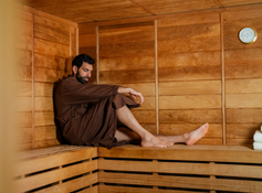 A guest relaxing in the sauna at Tenaya at Yosemite