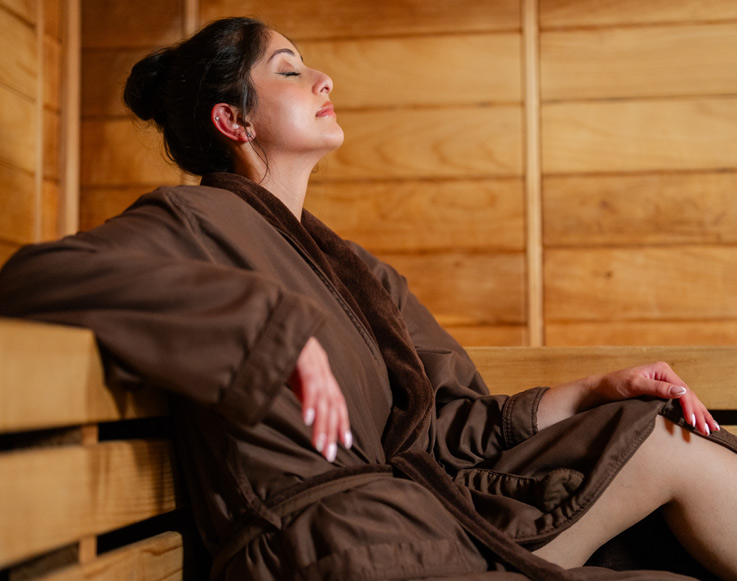 A guest relaxing in the sauna at Tenaya at Yosemite's Ascent Spa