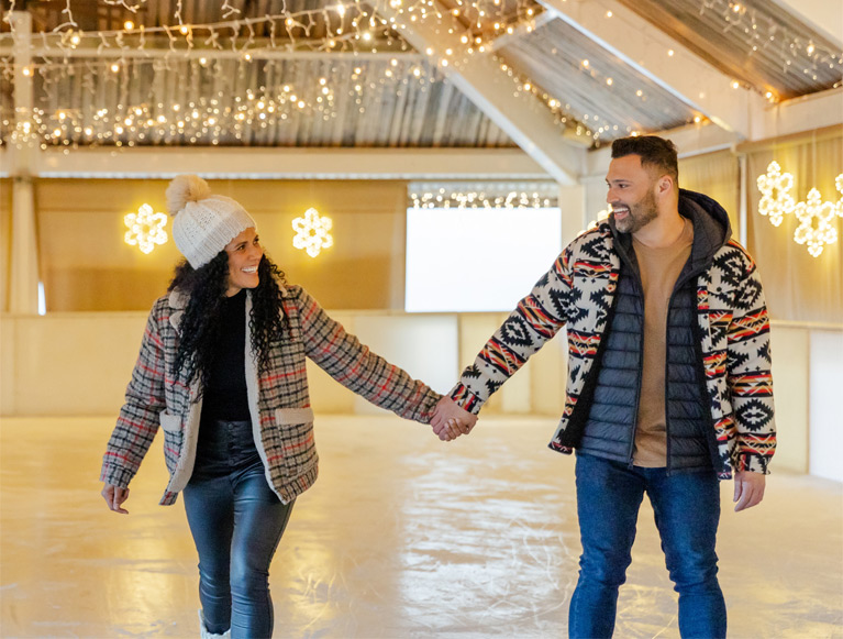 A couple ice skating at Tenaya at Yosemite