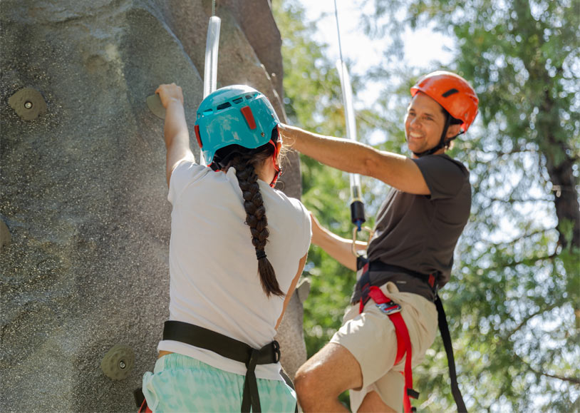 Home 7 A father and daughter enjoying the climbing wall at Tenaya at Yosemite