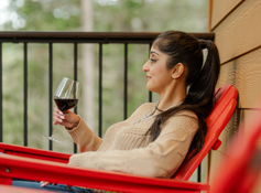 A guest enjoying a glass of wine at Tenaya at Yosemite