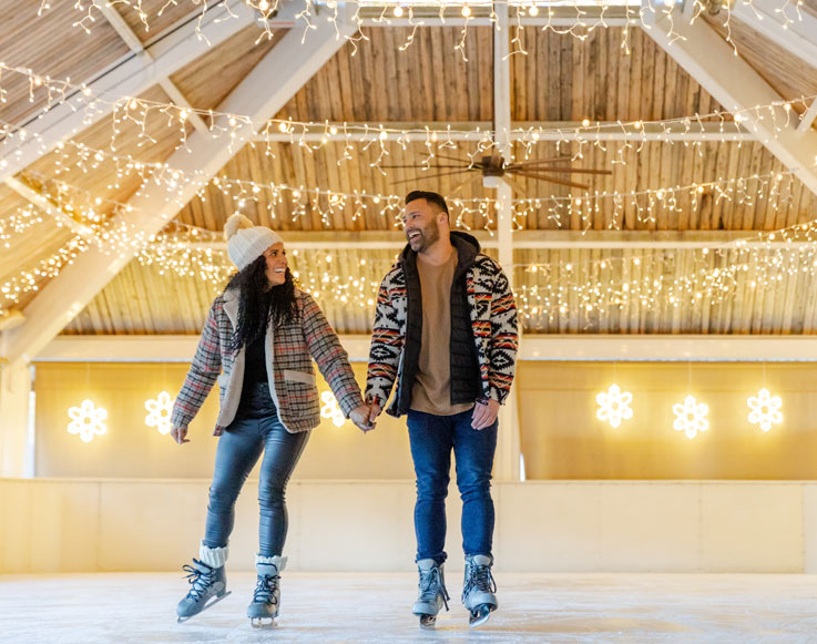 Two guests ice skating at Tenaya at Yosemite