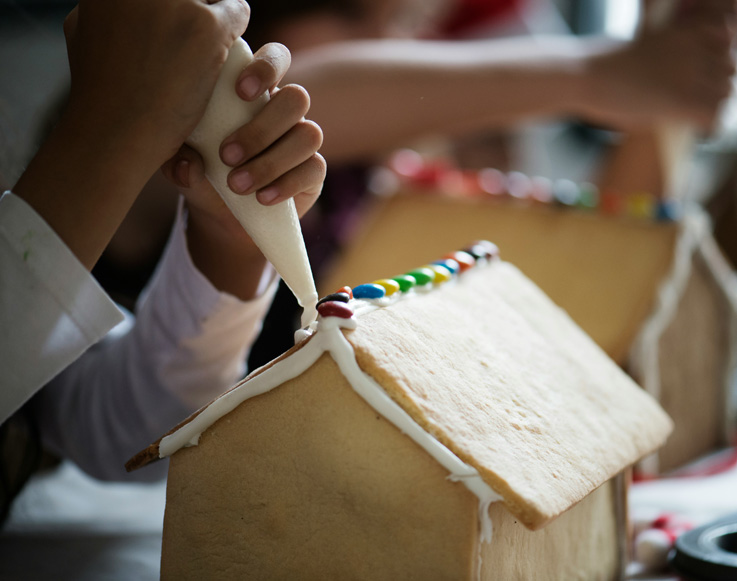 Decorating a gingerbread house at Tenaya at Yosemite
