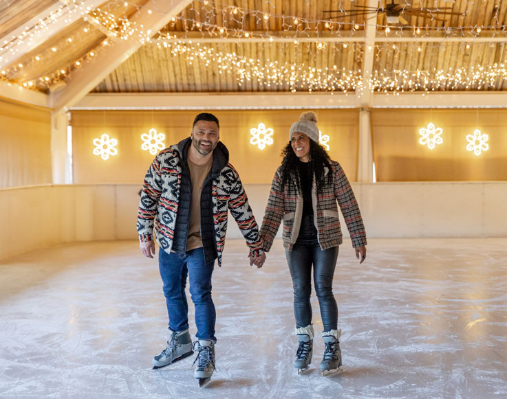 Two guests ice skating at Tenaya at Yosemite