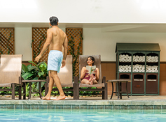 Two guests enjoying the indoor pool at Tenaya at Yosemite