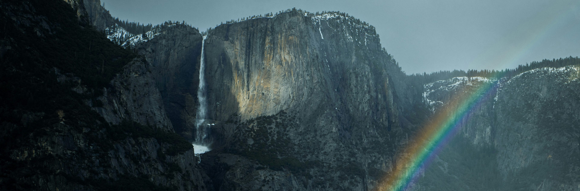 Yosemite Falls and a rainbow in Yosemite Valley
