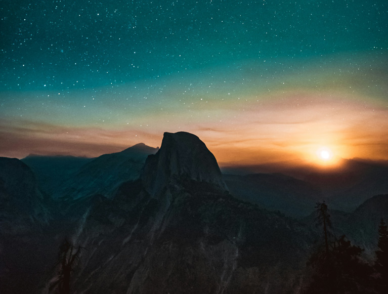 A beautiful starry sky over Half Dome in Yosemite Valley 