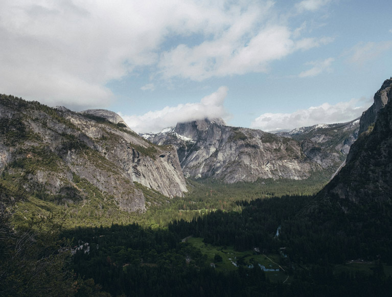 Half Dome obscured by clouds in Yosemite Valley