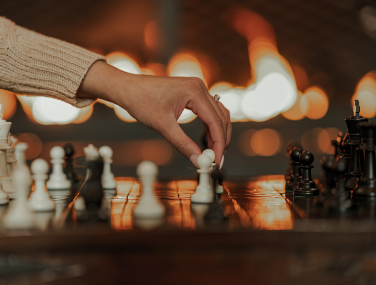 A guest playing chess at Tenaya at Yosemite
