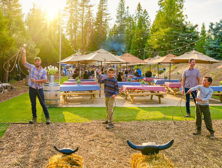 A group of guests practicing their roping skills at Tenaya at Yosemite's Gold Rush BBQ