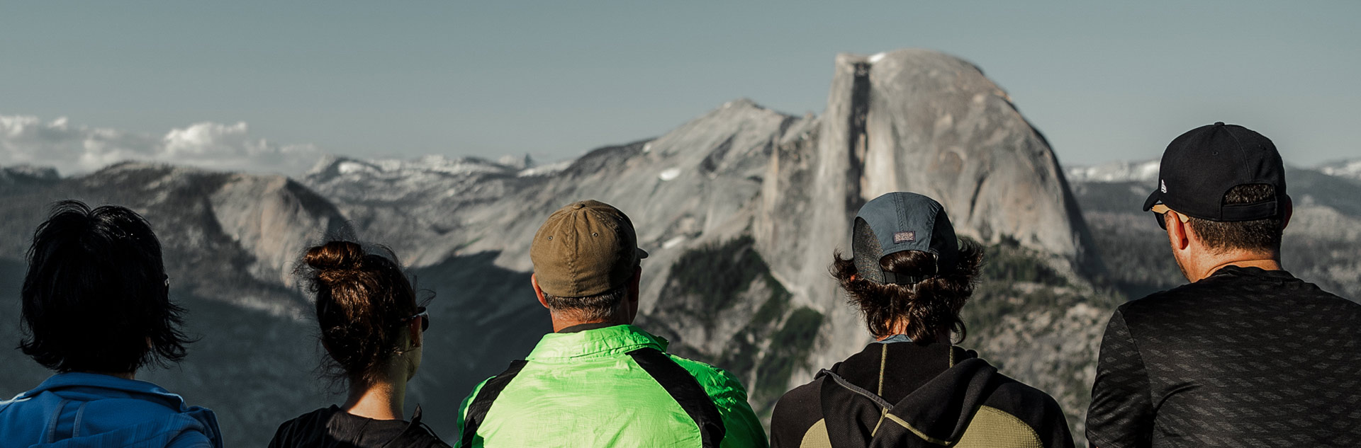 A group of Yosemite visitors looking at Half Dome