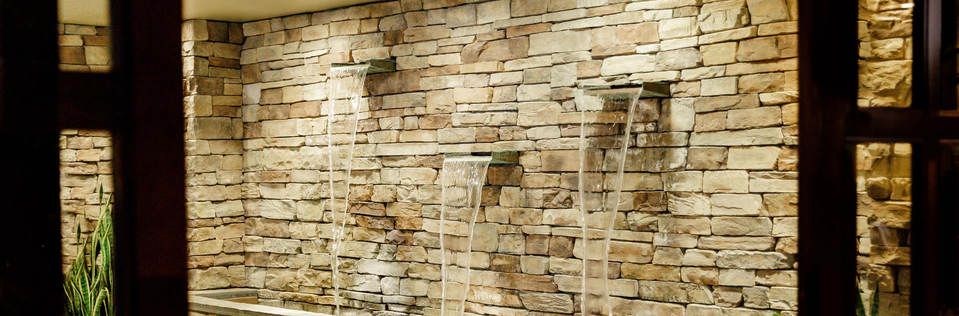 A decorative wall with a water feature at Ascent Spa at Tenaya at Yosemite