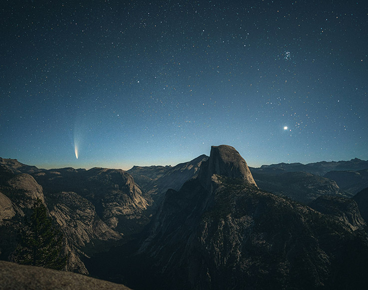 Half Dome in Yosemite Valley under a starry night sky